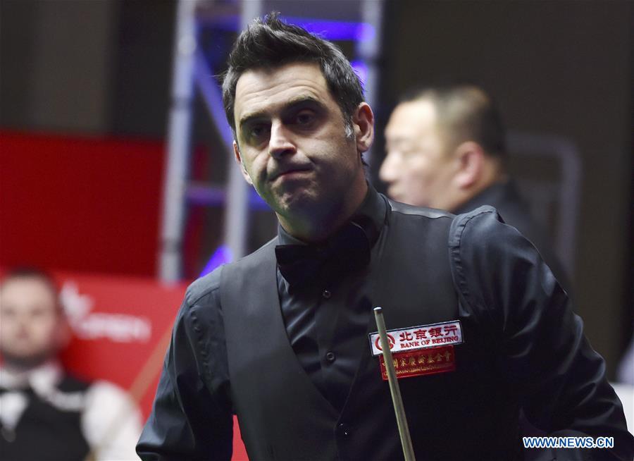 Ronnie O'Sullivan of England reacts during the second round match of 2017 World Snooker China Open Tournament against his compatriot Mark Joyce in Beijing, capital of China, March 29, 2017. Ronnie O'Sullivan lost by 4-5. (Xinhua/Zhang Chenlin) 