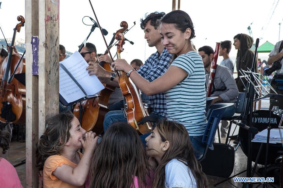 GREECE-PIRAEUS-SKARAMANGAS REFUGEE CAMP-MUNICIPAL YOUTH ORCHESTRA OF CARACAS-CONCERT