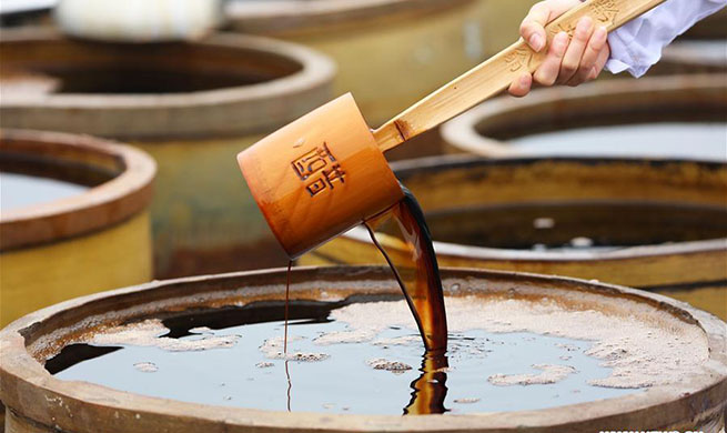 Workers make vinegar in SW China