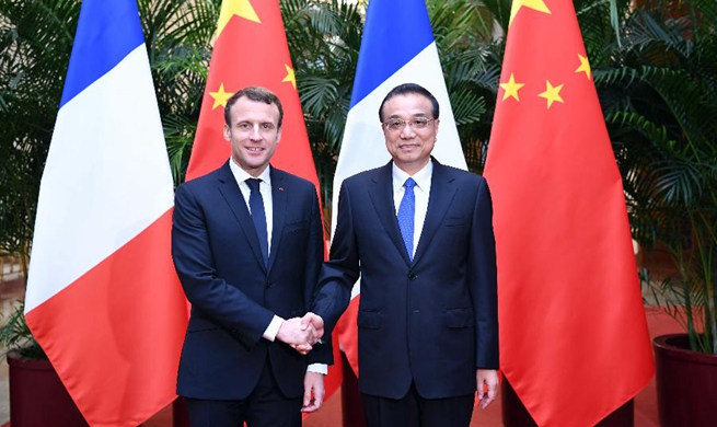Chinese premier meets visiting French president in Beijing