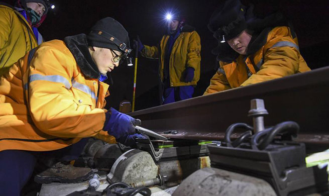 Engineers examine rail every night to ensure safety in Urumqi, NW China