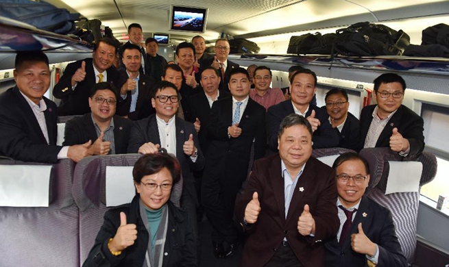 NPC deputies, CPPCC members from HK arrive in Beijing for annual "two sessions"