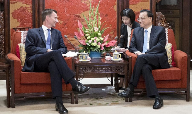 Chinese premier meets British foreign secretary