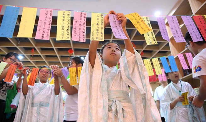 Children greet upcoming Mid-Autumn Festival in Hefei, E China