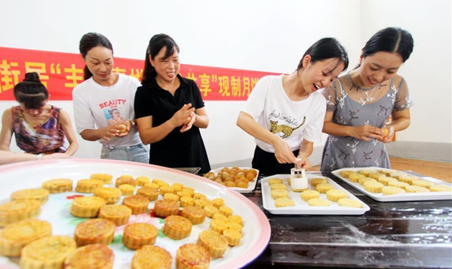 Chinese celebrate Mid-Autumn Festival by making mooncakes