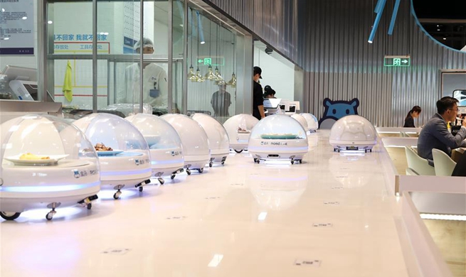 Robots serve food in Shanghai's smart restaurant