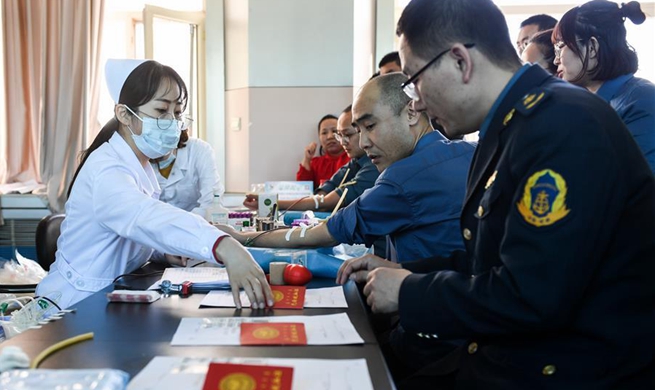Volunteers donate blood for injured people of mine accident in China's Inner Mongolia