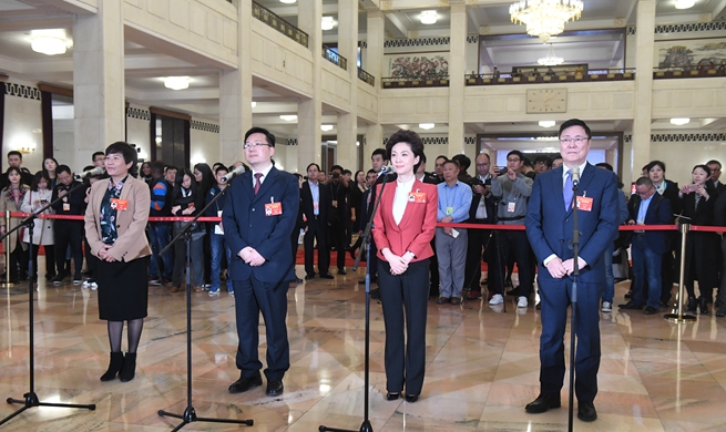 CPPCC members receive interview ahead of annual session