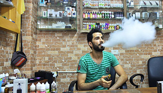 Feature: Economic situation forces Gazans to replace cigarettes with electronic smoking