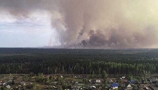 Russia declares state of emergency in four regions over wildfires