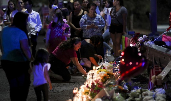 People take part in prayer and vigil for victims of shooting attack in El Paso, Texas