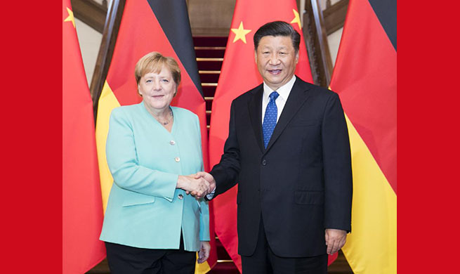 Xi meets German Chancellor Angela Merkel
