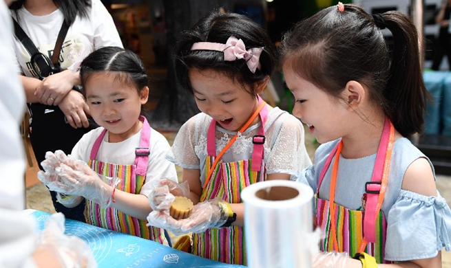 Children take part in activities to celebrate Mid-Autumn Festival across China