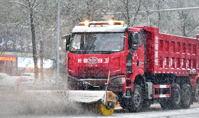 Sanitary workers and vehicles dispatched to clear snow in China's Changchun