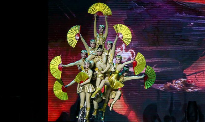 Members of China National Acrobatic Troupe perform in Quezon City, the Philippines