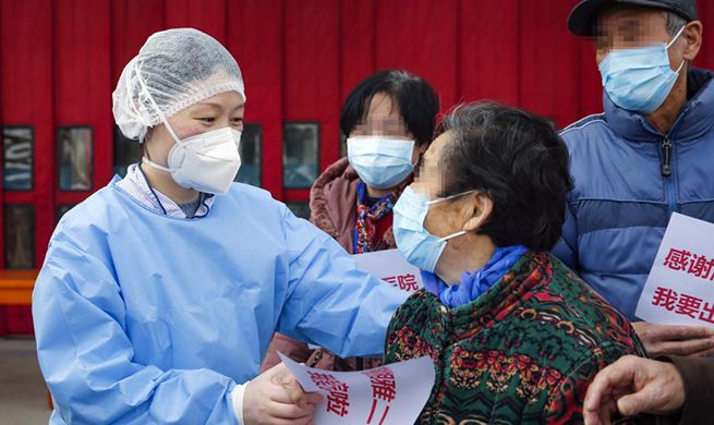 Recovered COVID-19 patients discharged from hospital in Wuhan