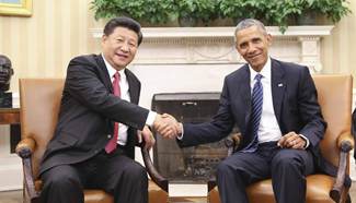 Chinese President Xi talks with Obama at White House