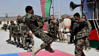 Afghan army soldiers perform during graduation ceremony