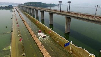 Boardwalk on bridge submerged by rising water at Tangxun Lake in China's Wuhan