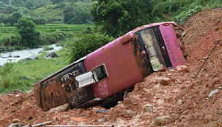 Landslide buries bus in east China
