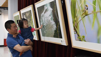 Exhibition on biodiversity of Nujiang River held in Beijing