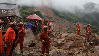 Rescuers work at accident site after east China landslide