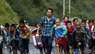 Pic story: Sang Lei, voluntary teacher in China's Yunnan