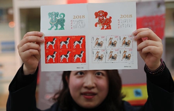 Chinese design legend creates stamps for Year of the Dog