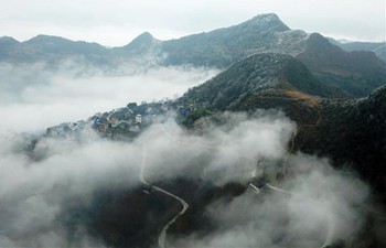 Sea clouds seen over Miao village in SW China