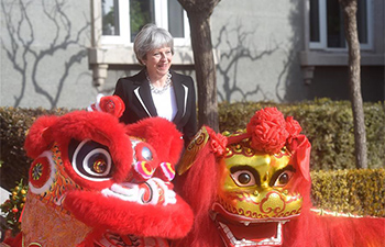 May attends cultural reception accompanied by British ambassador in Beijing
