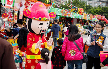 People do Spring Festival shopping in Macao for Chinese Lunar New Year