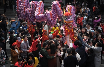 People perform dragon dance to celebrate Spring Festival in central China's Hunan