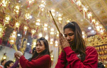 People pray at Thien Hau Temple in Los Angeles to celebrate Spring Festival
