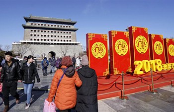 Tourists visit Qianmen street to enjoy scenery and delicacies