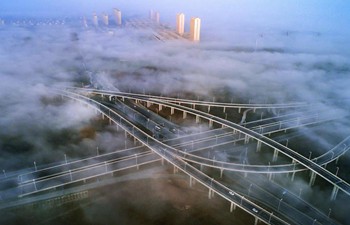 Fog envelops Zhouyu Overpass of National Highway 206