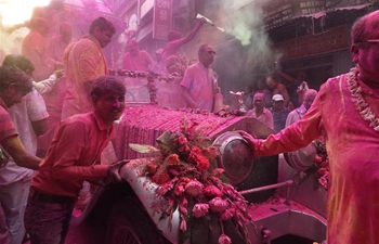 People celebrate Holi on eve of Holi Festival in India