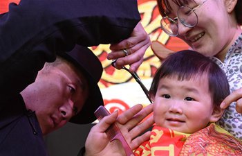 Child gets haircut to greet Er Yue Er in China's Anhui