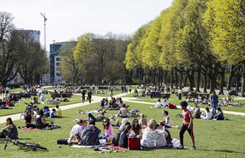 People enjoy sunshine as temperature rises in Brussels