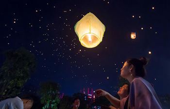 People fly Kongming lanterns in Jinghong, SW China's Yunnan