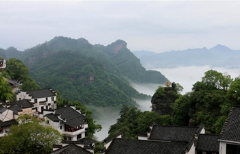 Tourists enjoy misty scenery across China