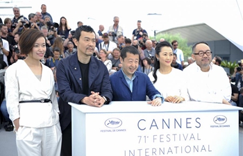 Cast members of film "Ash is Purest White" pose at Cannes Int'l Film Festival
