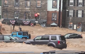 One missing after flash flooding rages through streets of Maryland town