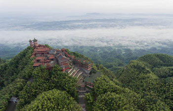 Scenery of clouds above bamboo forests and rural residence in China's Sichuan