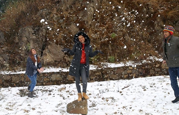 People enjoy first snowfall in Kathmandu, Nepal