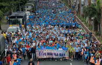 Volunteers participate in "solidarity walk" to mark start of government's rehabilitation project of Manila Bay