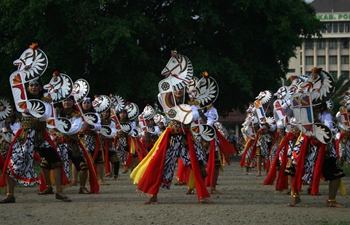 Dancers participate in Jathil mass dance at East Java, Indonesia