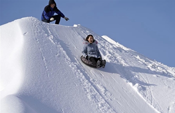 Tourists have fun at ski resort in Jilin