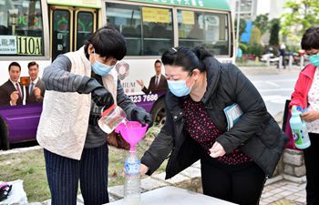 Local residents get free disinfectant distributed by Hong Kong Federation of Trade Unions