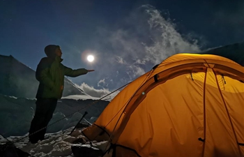 Full moon pictured at advance camp of Mount Qomolangma in SW China's Tibet