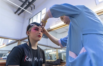 Young students pass on traditional Chinese opera